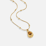 Elegantna zlatna ogrlica sa tigrovim okom